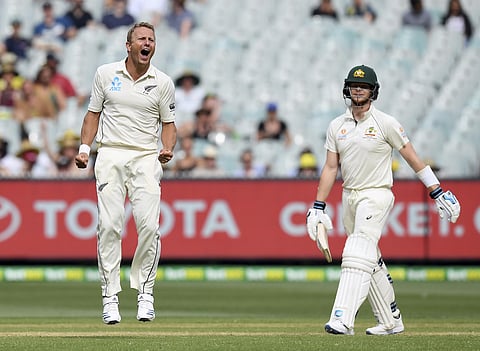 New Zealand's Neil Wagner, left, celebrates capturing the wicket of Australia's Steven Smith, right. (Photo | AP)
