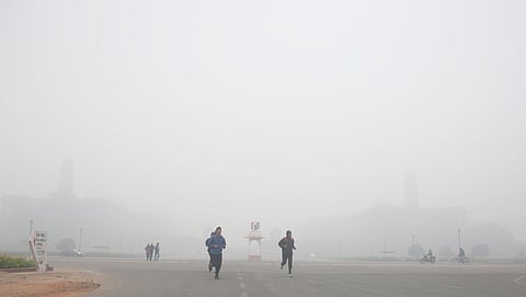 Joggers exercise at Raisina Hills on a cold foggy morning in New Delhi on on Saturday (Photo| Shekhar Yadav, EPS)