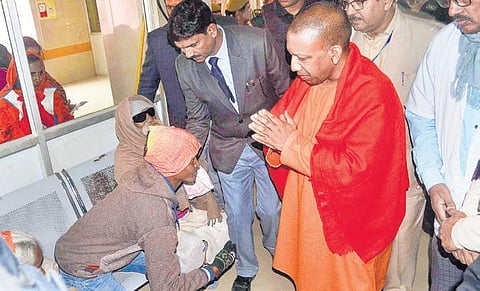 Yogi Adityanath at the Deen Dayal hospital in Varanasi on Saturday. (Photo | PTI)
