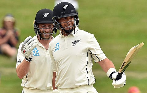 New Zealand's Ross Taylor (R) celebrates reaching his century (100 runs) with a teammate Kane Williamson during the fifth day of the second cricket Test match between England and New Zealand. (Photo | AFP)