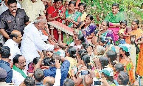 Former Prime Minister and JDS supremo H D Deve Gowda meets supporters outside party candidate Ashok Pujari’s house in Gokak | Ashishkrishna HP