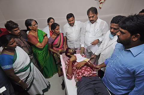 Endowments minister Vellampalli Srinivasrao along with MLA Malladi Vishnu handovers cheques to operated patients at Government general hospital in Vijayawada (Express photo by Prasant Madugula)