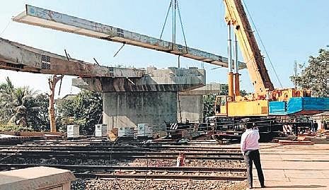 Railway tracks blocked after a portion of the overbridge collapses at Shobharampur. (Photo | EPS)
