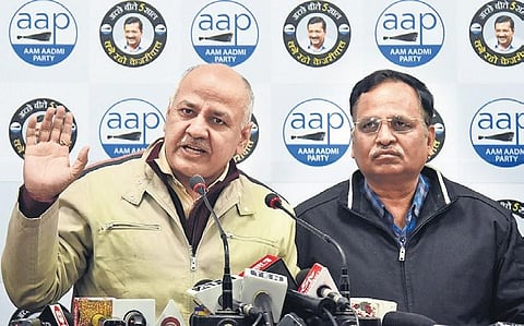 Deputy CM Manish Sisodia along with Health Minister Satyendar Jain addresses a press conference at AAP HQ in New Delhi on Sunday. (Photo | Parveen Negi, EPS)