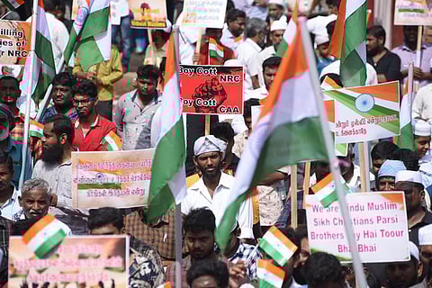 People stage protest against CAA near alandur metro station, in Chennai.(EPS/ R.Satish babu)