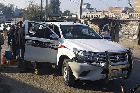 Afghan security force personnel inspect a vehicle, which was carrying Japanese doctor Tetsu Nakamura, following an attack in Jalalabad on Wednesday (Photo| AFP)