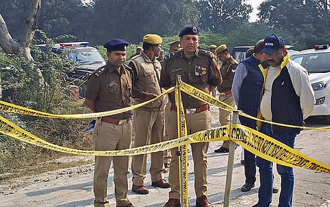 Police personnel investigate at the site where a rape victim was allegedly set ablaze by five men at Sindupur village in Unnao district Thursday. (Photo | PTI)
