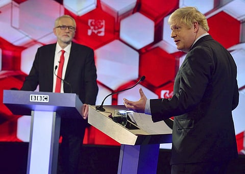 Opposition Labour Party leader Jeremy Corbyn, left, and Britain's Prime Minister Boris Johnson, during a head to head live Election Debate at the BBC TV studios in Maidstone, England, Friday Dec. 6, 2019. (Photo | AP)