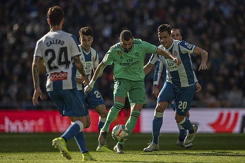 Real Madrid's Karim Benzema, center, duels for the ball. (Photo | AP)