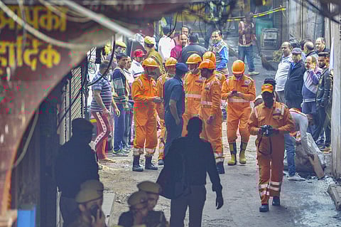 National Disaster Response Force carry out rescue operation at factory in Rani Jhansi Road where a major fire broke out in New Delhi. (Photo | PTI)