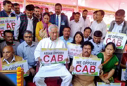 Former Assam chief minister Tarun Gogoi with Assam Pradesh Congress Committee APCC activists stage a protest after the Citizenship Amendment Bill was cleared by the Union cabinet recently in Guwahati Friday. (Photo | PTI)