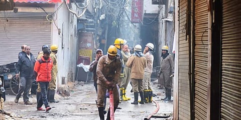 Firemen at the site of a fire in New Delhi. (Photo | Parveen Negi, EPS)