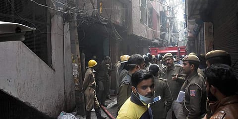 Firemen at the site of a fire in New Delhi. (Photo | PTI)
