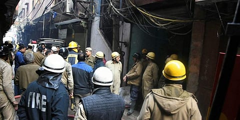 Fire fighters carry out rescue operations at Rani Jhansi Road after a major fire broke out, in New Delhi, Sunday morning. (Photo | PTI)