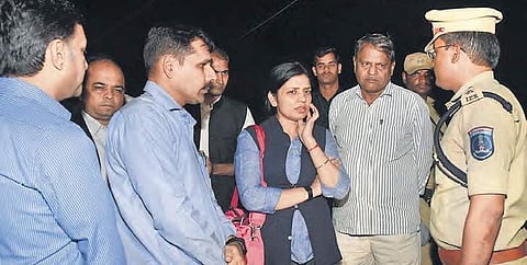 Members of the NHRC team interact with the police near Hyderabad on Saturday