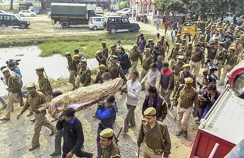 Family members and relatives carry the mortal remains of Unnao rape victim for cremation under tight security at Unnao Sunday. (Photo | PTI)