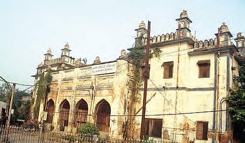 Plants seen growing in the building of Nizamia Tibbi Unani Hospital, Hyderabad, as the heritage building is left to perish | Sathya keerthi