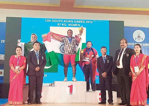 P Anuradha of Nemmelipatti in Pudukkottai won gold in the 87 kg category at the South Asian Games at Kathmandu in Nepal. (Photo | EPS)qP Anuradha of Nemmelipatti in Pudukkottai won gold in the 87 kg category at the South Asian Games at Kathmandu in Nepal.