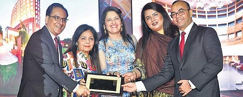 (Second from left) Satish Bala Malhotra, Chairperson of MBD Group, with her team. (Photo |EPS)