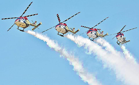 Pics: Pushkar V/IAF’s Sarang aerobatics team flying the ALH Dhruv at Aero India 2019 at Yelahanka air base in Bengaluru on Friday