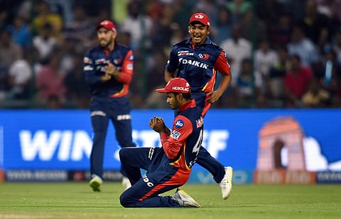 Delhi Daredevils' Shreyas Iyer takes a catch while his teammates watch on. (File Photo | PTI)