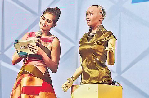 The anchor breaks out into laughter in response to answers by Sophia, the first humanoid robot, at the IAA World Congress | Albin Mathew