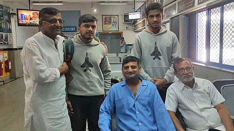 Wing Commander Vijay Shelke (in blue shirt) and his family meet Chethan Kumar (second from left) at a hospital in Bengaluru on Friday. (Photo