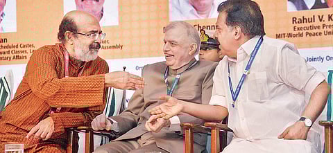 Governor P Sathasivam listens intently as Opposition leader Ramesh Chennithala and Finance Minister Thomas Isaac are engaged in animated discussion during Nat’l Students’ Parliament inauguration in T’Puram on Saturday | Vincent Pulickal