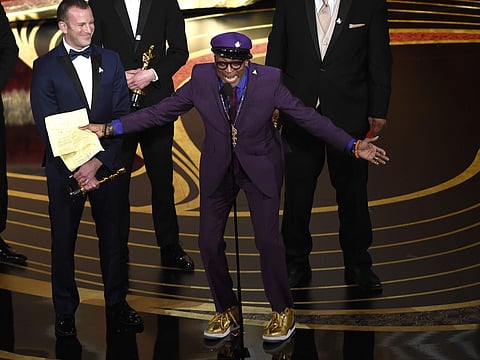 Charlie Wachtel, left, and Spike Lee accept the award for best adapted screenplay for 'BlacKkKlansman' at the Oscars. (Photo | AP)