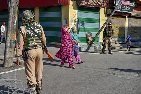 Security personnel stands guard during restrictions and strike called by separatists after the killing of PhD scholar-turned-Hizbul Mujahideen commander Manaan Bashir Wani. (Photo| PTI)