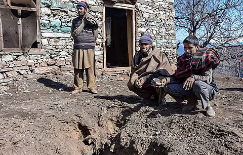 Poonch villagers show a damage portion in front of a house after shelling by the Pakistani Army in Chhajla Patri village near the LoC (Photo | PTI)