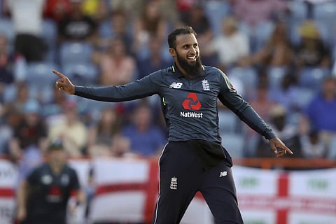 England's Adil Rashid celebrates taking the wicket of West Indies' Oshane Thomas to win the fourth One Day International cricket match by 30 runs at the National Stadium in St. George's. (Photo | AP)