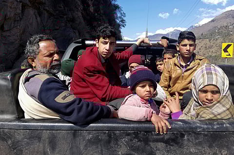 People flee the town of Chakoti which is about 5 km, from the Pakistan Indian border, following the intense exchange of fire between Pakistan and India, at the LoC. | AP