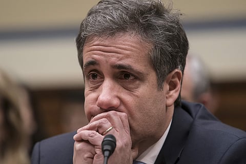 Michael Cohen, President Donald Trump's former personal lawyer, becomes emotional as he finishes a day of testimony to the House Oversight and Reform Committee, on Capitol Hill in Washington. | AP