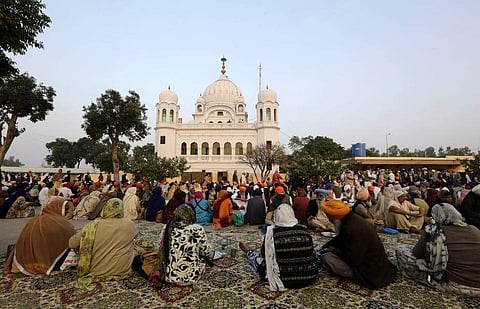 Sikh pilgrims at the shrine for Guru Nanak Dev in Kartarpur, Pakistan ( Photo | The Coversation.com)