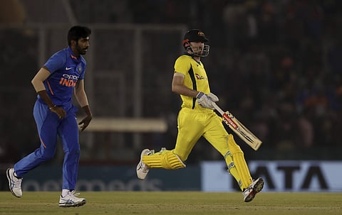 Australia's Ashton Turner, right, completes a run during the fourth one day international cricket match between India and Australia in Mohali. (Photo | AP)