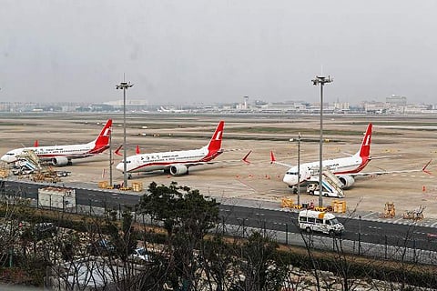 This photo taken on March 11, 2019 shows three Boeing 737 MAX 8 planes from Shanghai Airlines parked at Shanghai Hongqiao International Airport in Shanghai. (Photo | AFP)