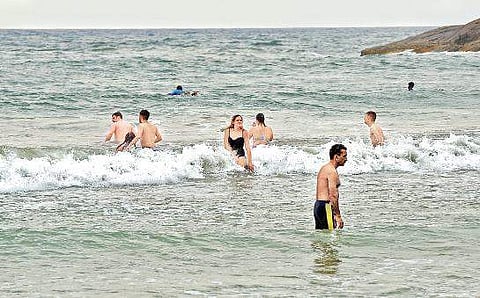 Foreign tourists at Kovalam beach. (Photo | Vincent Pulickal, EPS)