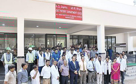 Hospital president Ravi Kumar, doctors and staff after the formal inauguration of the OPD at AIIMS, Mangalagiri in Guntur district on Tuesday I P Ravindra Babu