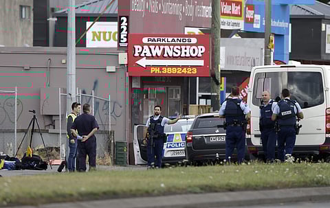Police stand outside a mosque in Linwood, Christchurch | AP