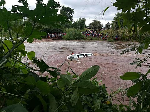 A car being washed away by the cyclone. (Photo | Twitter)