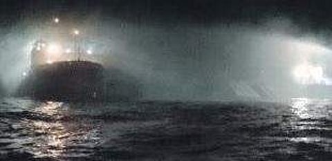 A Coast Gurad ship dousing the fire on board the vessel Sagar Sampada.