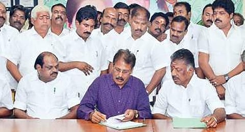 PT chief K Krishnasamy inks the poll pact in AIADMK coordinator O Panneerselvam’s presence.| Express