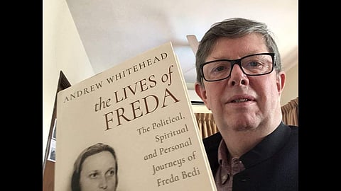 Author Andrew Whithead with the book Lives of Freda Bedi: An ode to a remarkable woman. (Photo | Youtube screengrab)