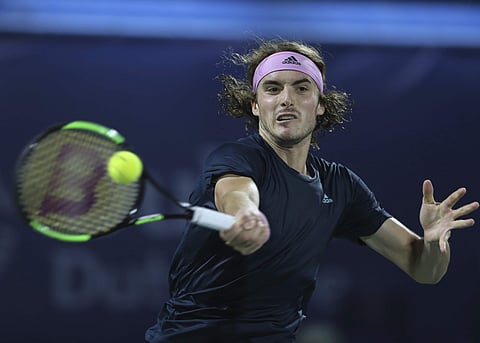 Stefanos Tsitsipas of Greece returns the ball to Gael Monfils of France during their semi final match at the Dubai Duty Free Tennis Championship. (Photo | AP)