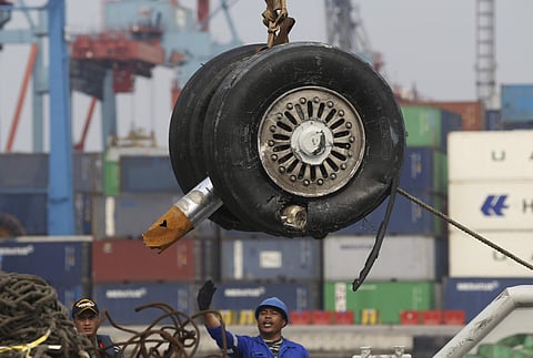 A crane moves a pair of wheels recovered from the Lion Air jet that crashed into the Java Sea for further investigation at Tanjung Priok Port in Jakarta, Indonesia.( Photo | AP)