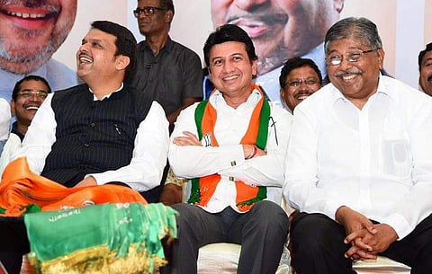 Ranjitsinh Mohite-Patil (centre) with Maharashtra CM Devendra Fadnavis after joining BJP at an event in Mumbai. (Photo | Twitter/@BJP4Maharashtra)