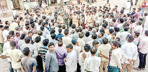 Police interact with people in a faction-hit village of Jammalamadugu Assembly segment on Wednesday | Express