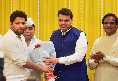 Sujay Vikhe Patil, the son of Congress leader and Leader of Opposition in the Assembly Radhakrishna Vikhe Patil. A file photo of Sujay Radhakrishna Vikhe Patil being welcomed by Maharashtra Chief Minister Devendra Fadnavis as he joins BJP in Mumbai. (Fil