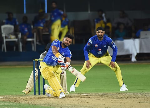 Chennai Super Kings’ Suresh Raina cuts loose during a practice match as Harbhajan Singh looks on, at MA Chidambaram Stadium in Chennai on Sunday. (Photo| Ashwin Prasath, EPS)